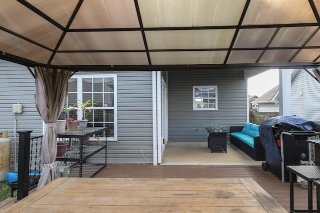 deck with a gazebo, grilling area, and outdoor lounge area