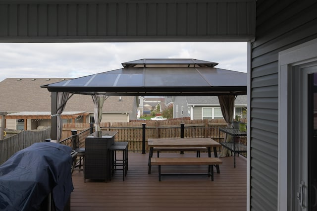 wooden deck featuring a gazebo and grilling area