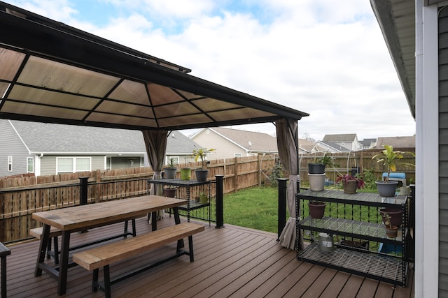 deck with a gazebo and a yard