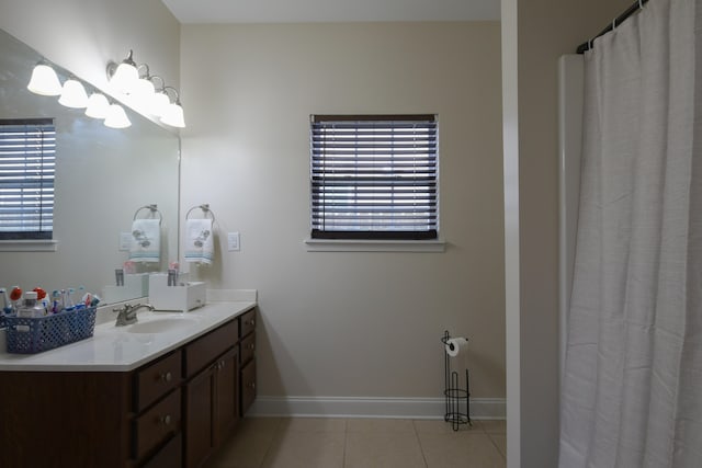 bathroom with tile patterned floors and vanity