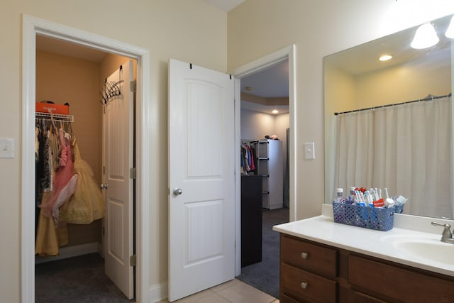 bathroom with tile patterned floors and vanity