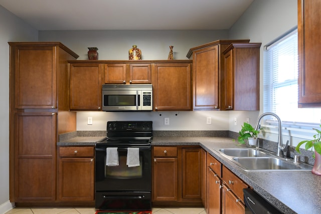 kitchen featuring dishwashing machine, sink, black electric range oven, and light tile patterned floors