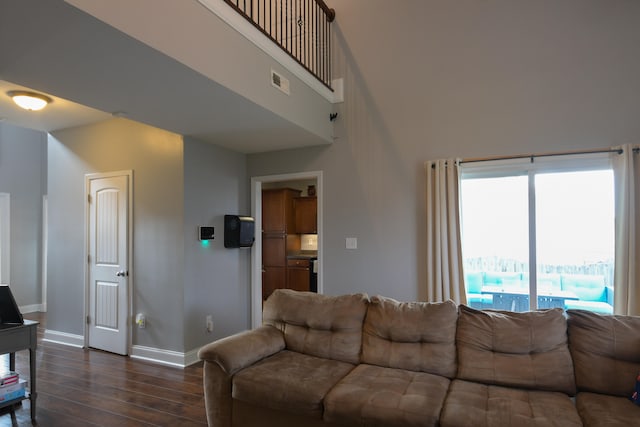 living room featuring dark wood-type flooring