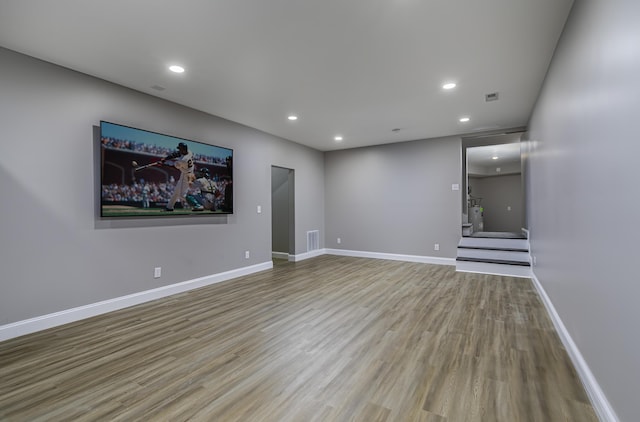 unfurnished living room featuring light hardwood / wood-style flooring