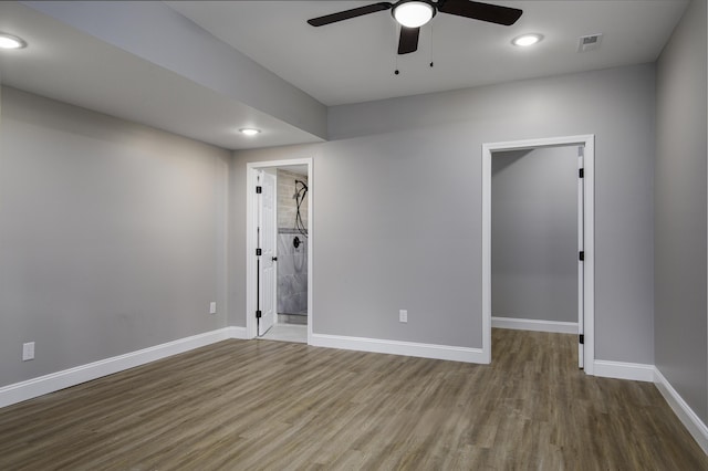 empty room with hardwood / wood-style flooring and ceiling fan