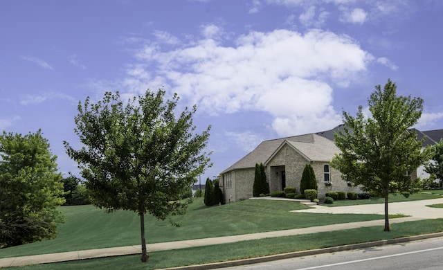 view of front of home with a front lawn