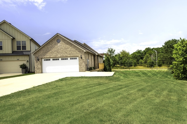 view of front of house featuring a garage and a front lawn