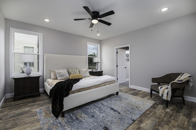 bedroom with ceiling fan and dark hardwood / wood-style flooring