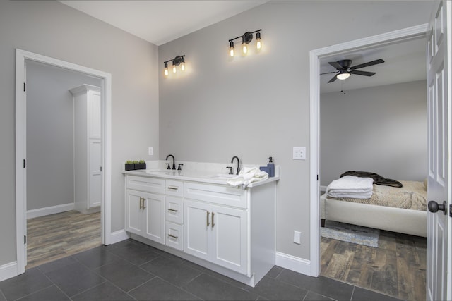 bathroom featuring tile patterned flooring, vanity, and ceiling fan