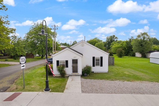 bungalow-style house with a front yard