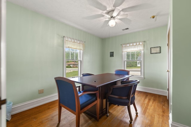 dining space with baseboards, visible vents, plenty of natural light, and light wood-style floors