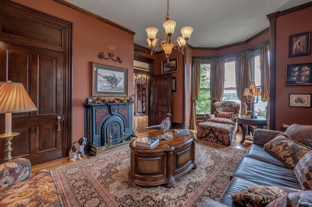 1023 Riverside Dr, Greenup, KY 41144 - living area with a chandelier, ornamental molding, wood finished floors, and a fireplace