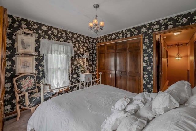 1023 Riverside Dr, Greenup, KY 41144 - carpeted bedroom with wallpapered walls, a closet, a chandelier, and ornamental molding