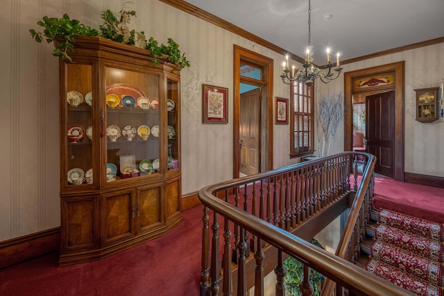 1023 Riverside Dr, Greenup, KY 41144 - hall with carpet flooring, a chandelier, ornamental molding, baseboards, and an upstairs landing