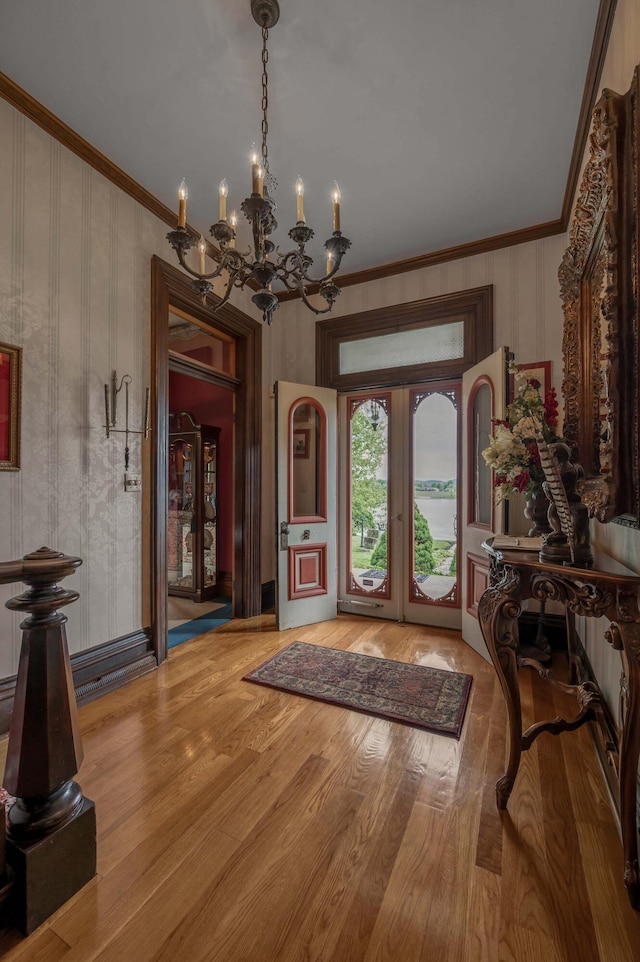 1023 Riverside Dr, Greenup, KY 41144 - entrance foyer with a chandelier, crown molding, and wood finished floors