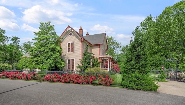 1023 Riverside Dr, Greenup, KY 41144 - view of side of property with a chimney and a fenced front yard