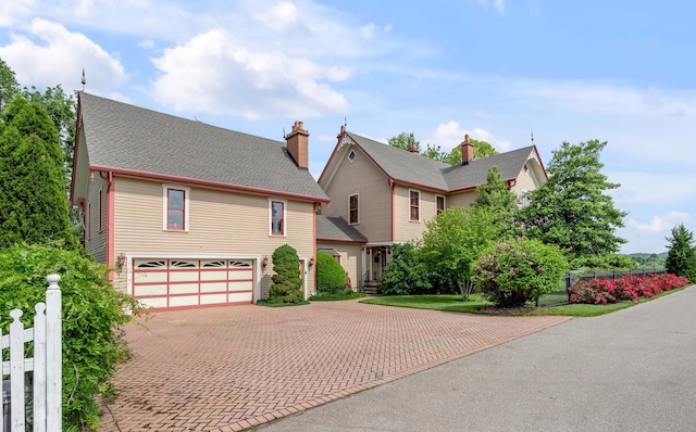 1023 Riverside Dr, Greenup, KY 41144 - view of front of property with decorative driveway, a garage, and fence