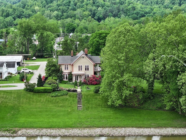 1023 Riverside Dr, Greenup, KY 41144 - view of subject property featuring a heavily wooded area and a nearby body of water