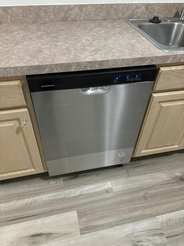 room details featuring a sink and dishwasher