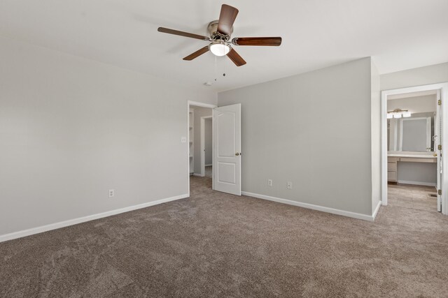 unfurnished bedroom with carpet floors, baseboards, and a ceiling fan