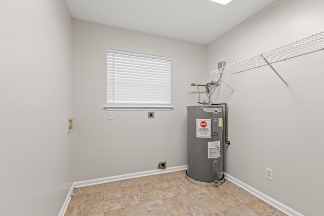 utility room featuring electric water heater