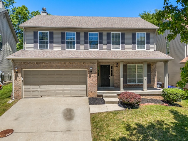 view of front of house featuring covered porch, concrete driveway, brick siding, and a front lawn