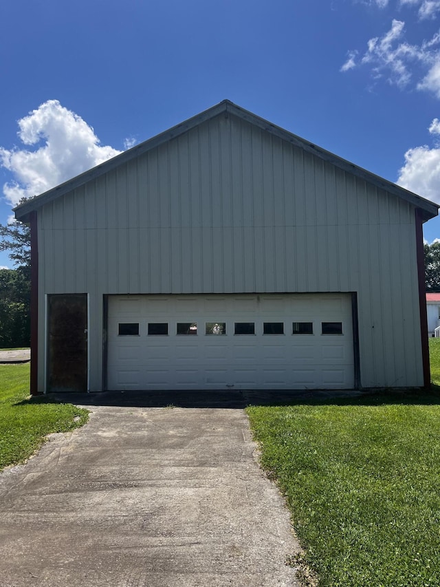 garage featuring a lawn