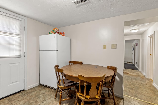 858 Lylesville St, Paris, KY 40361 - dining area with a textured ceiling and baseboards
