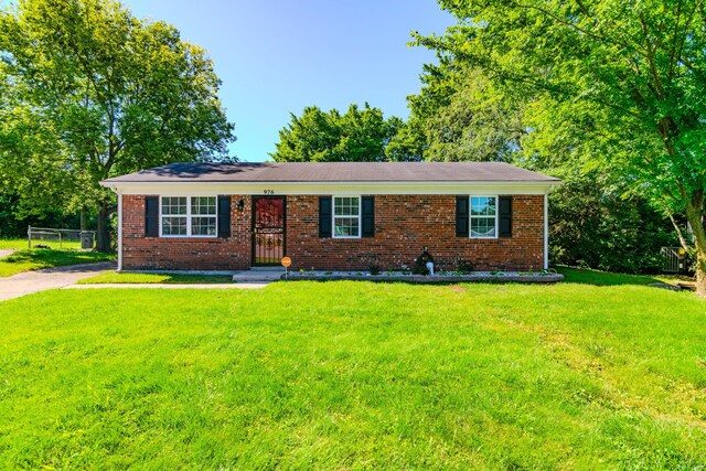 ranch-style home with a front yard