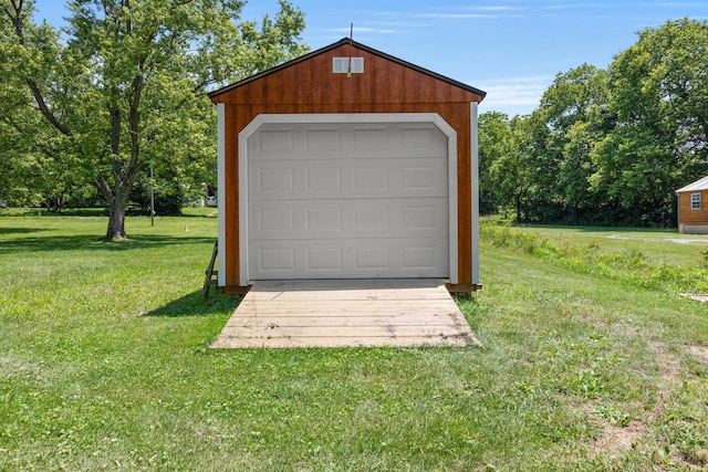 garage featuring a yard