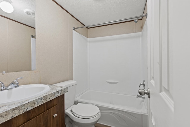 full bathroom with vanity, bathtub / shower combination, toilet, ornamental molding, and a textured ceiling