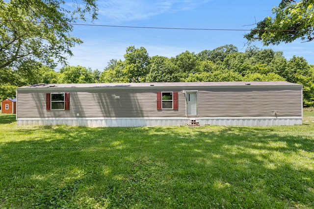 view of front of home with a front lawn