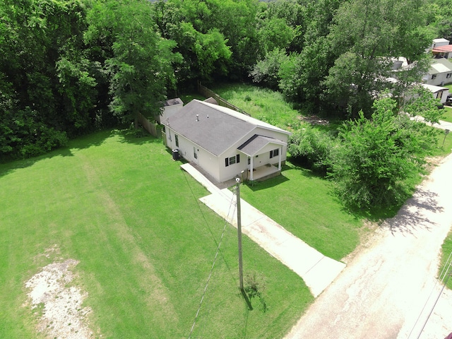 view of front of home featuring a front yard and central air condition unit