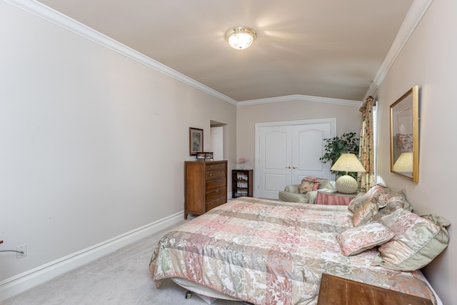 bedroom with crown molding, vaulted ceiling, carpet floors, and a closet