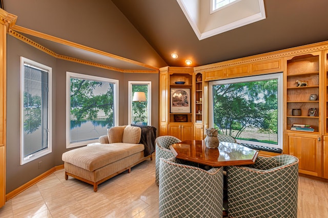 dining area with high vaulted ceiling