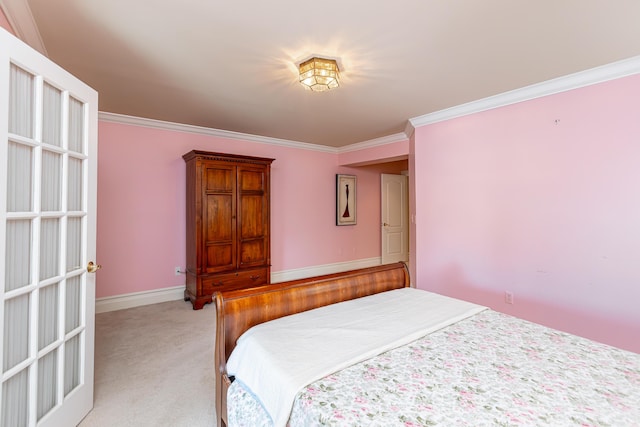 bedroom with ornamental molding and light colored carpet