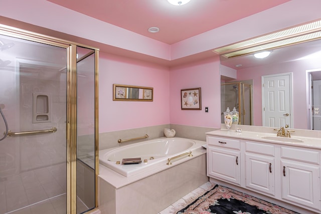 bathroom with vanity, tile patterned flooring, and plus walk in shower