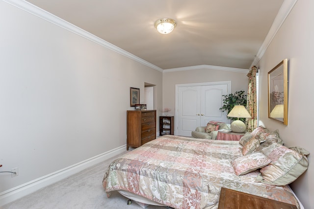 bedroom featuring carpet, lofted ceiling, and ornamental molding