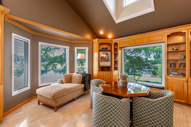 dining space featuring high vaulted ceiling