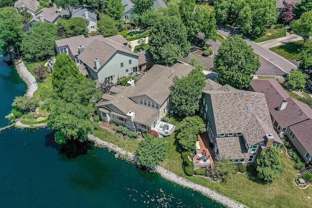 birds eye view of property with a water view