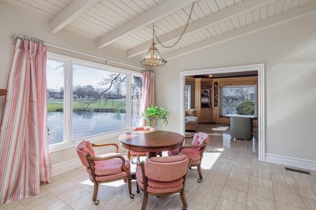 dining space featuring a water view, wood ceiling, light tile patterned floors, and vaulted ceiling with beams