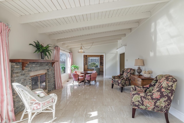 living area featuring beamed ceiling