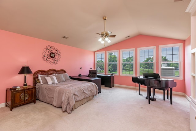 carpeted bedroom with multiple windows, vaulted ceiling, and ceiling fan