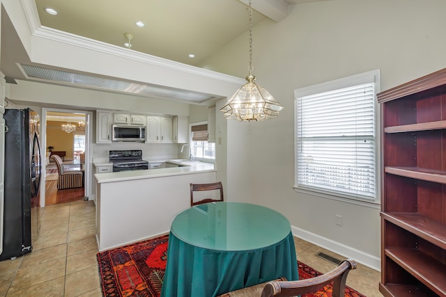 kitchen featuring kitchen peninsula, decorative light fixtures, sink, white cabinets, and black appliances