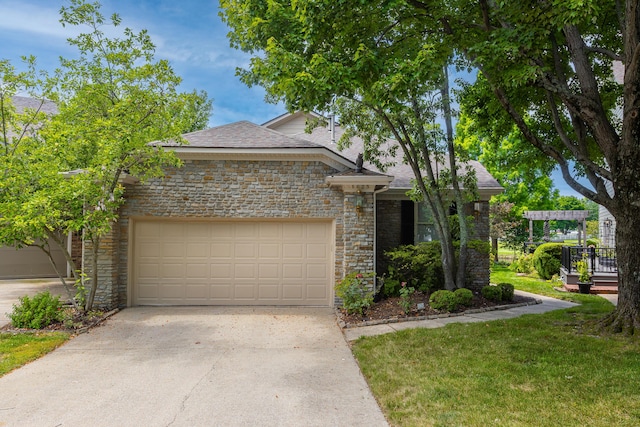 view of front of home featuring a garage and a front lawn