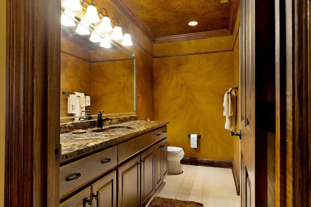 bathroom featuring toilet, ornamental molding, and vanity