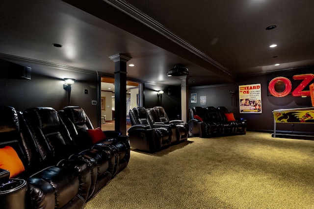 cinema room with ornamental molding, ornate columns, and carpet floors