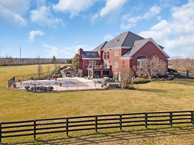 view of yard featuring stairway, a patio, a rural view, and fence