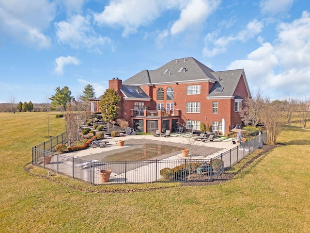 back of house with a yard, a patio area, and fence