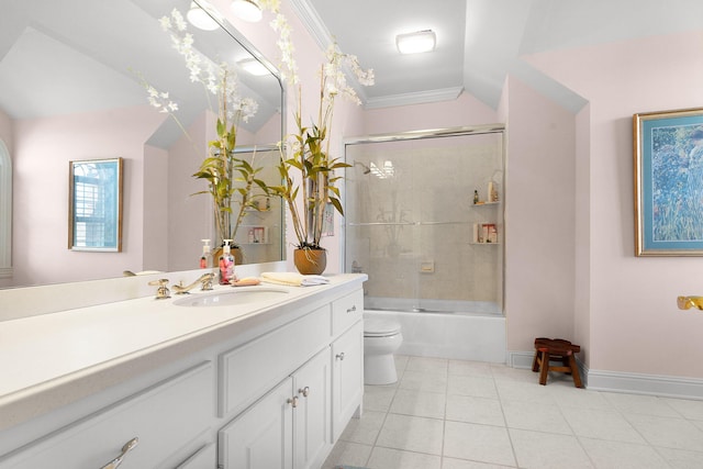 full bath featuring vanity, lofted ceiling, bath / shower combo with glass door, tile patterned floors, and toilet